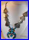 Vintage-Sterling-Silver-And-Rare-Turquoise-Navajo-Sqaush-Blossom-Necklace-01-ifz